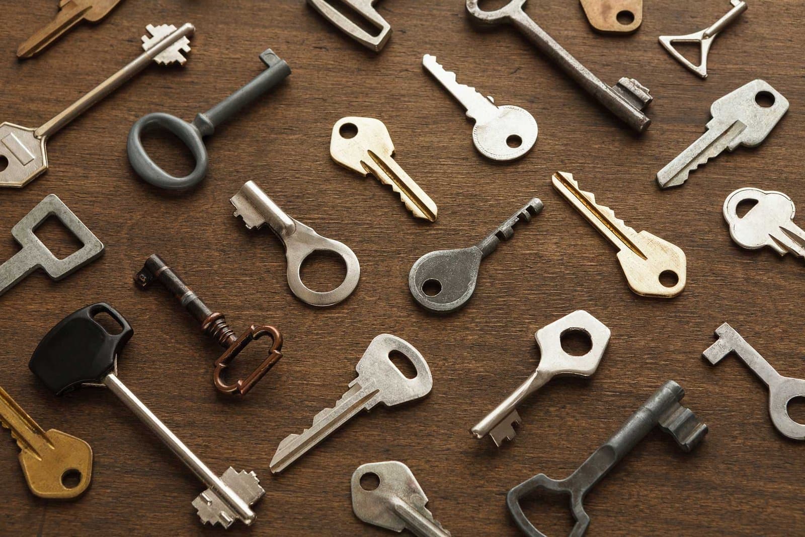 Assorted keys on a wood table